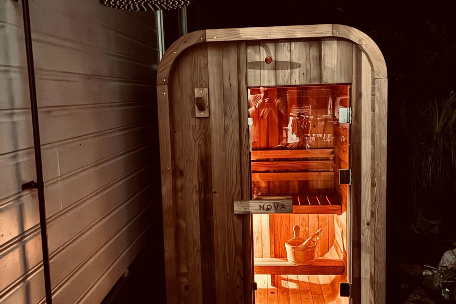 Nova Sauna Lite glowing from inside at night